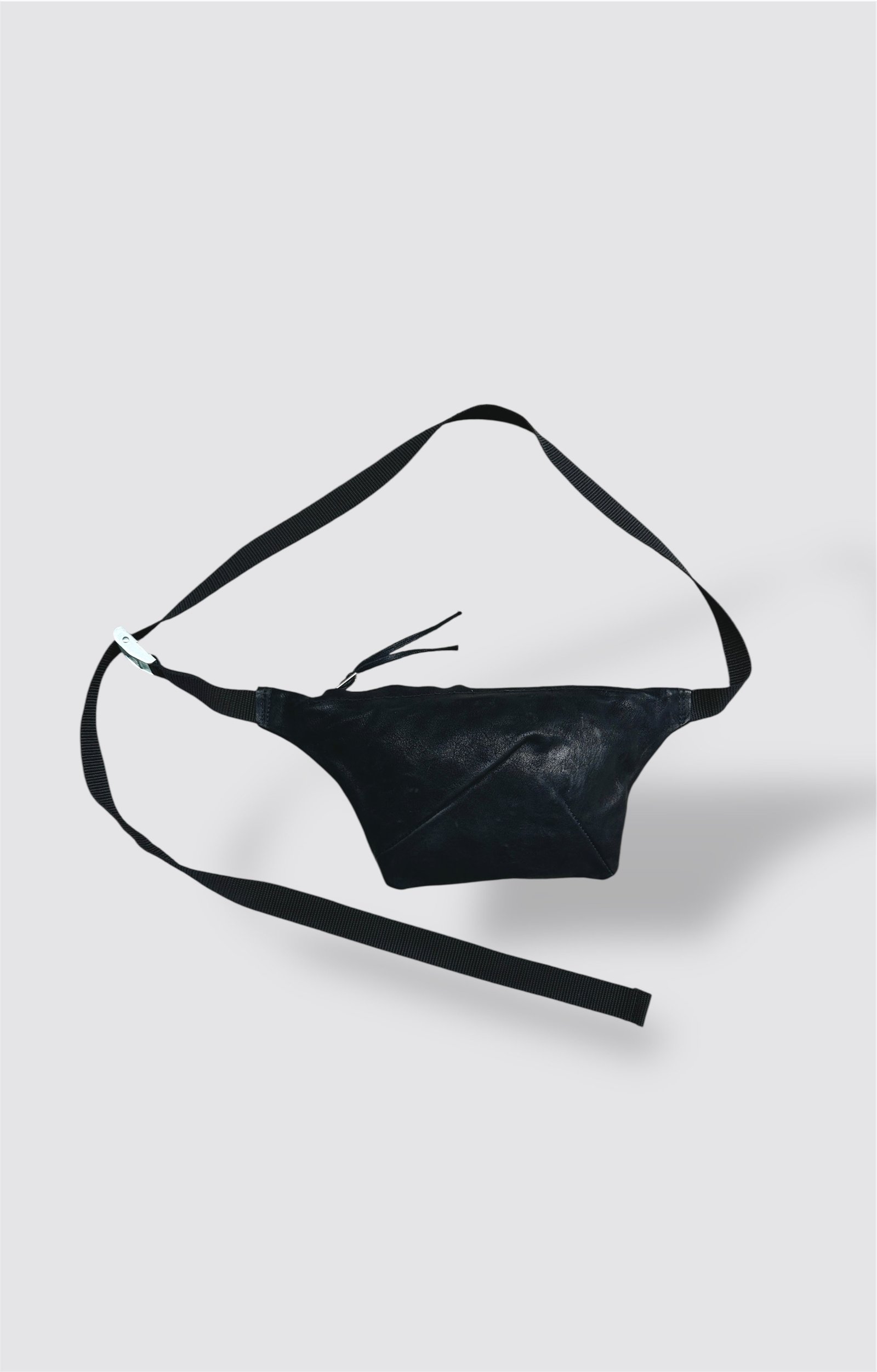 a black leather bag with a strap